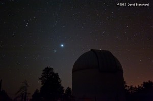 Venus and Jupiter shine brightly above the telescope dome at the Lowell Observatory Anderson Mesa Station.