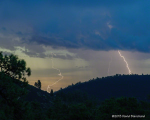 Lightning behind the cinder hills in Sunset Crater National Monument.