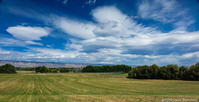 Wave clouds stand above recently cut fields in eastern Washington.