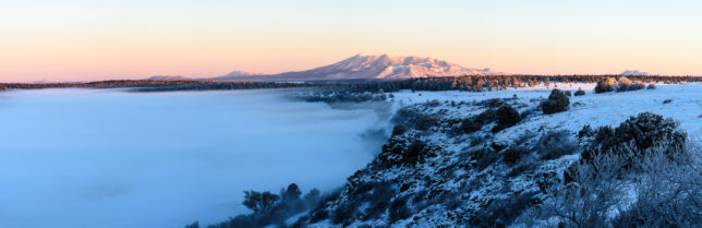 A shallow layer of fog covers Mormon Lake.