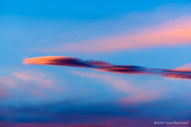 Sunset colors on wave clouds.
