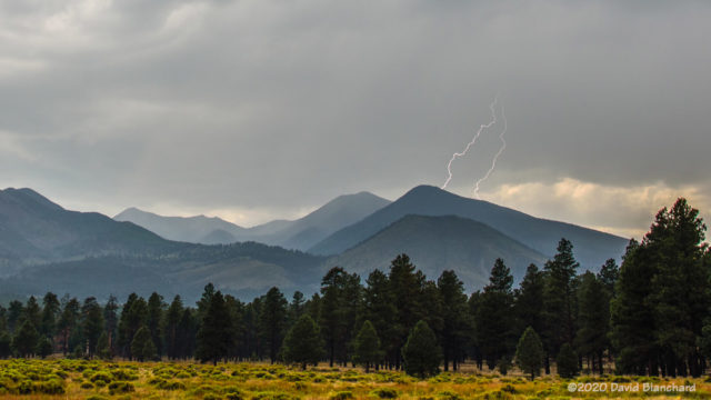Weak storms over the San Francisco Peaks produced these two bolts of lightning.