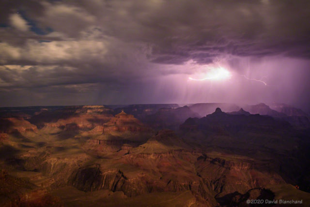 In-cloud lightning partially illuminates Grand Canyon while the nearly-full Moon provides additional illumination.