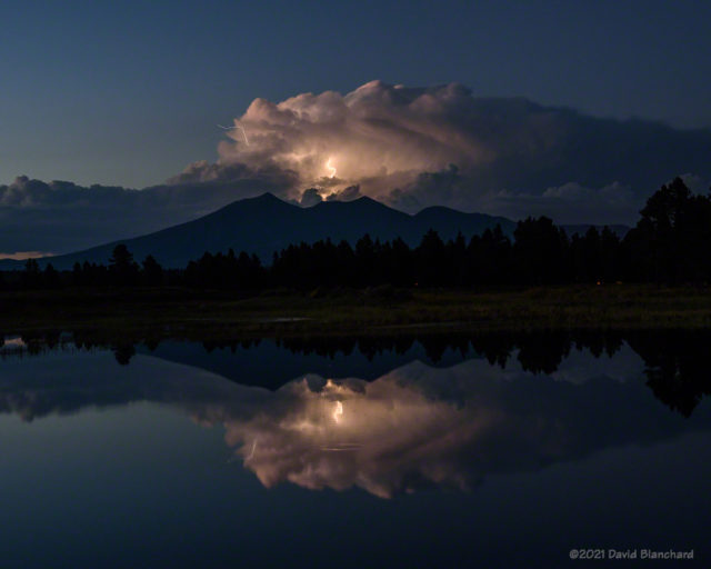 Lightning reflected in the ponds of the Kachina Wetlands.