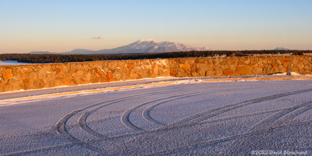 Tire tracks in the new snow at Mormon Lake overlook.