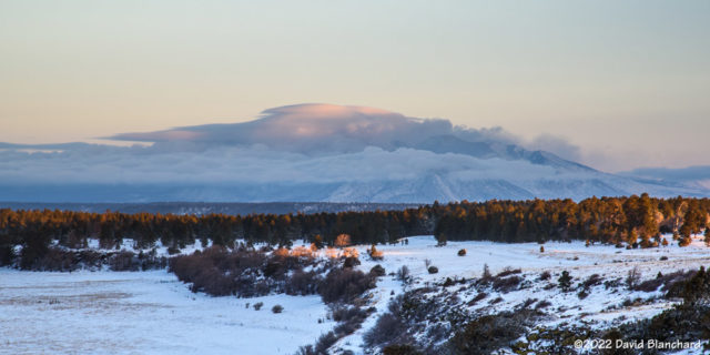 Clouds blow across the top of the San Francisco Peaks in the wake of a departing storm.