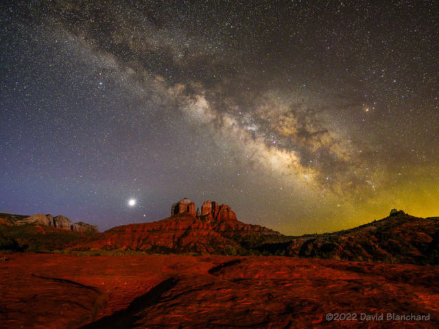 The Milky Way and Galactic Center rise above Cathedral Rock. Venus and Mars are also visible just above the horizon and to the left of Cathedral Rock.