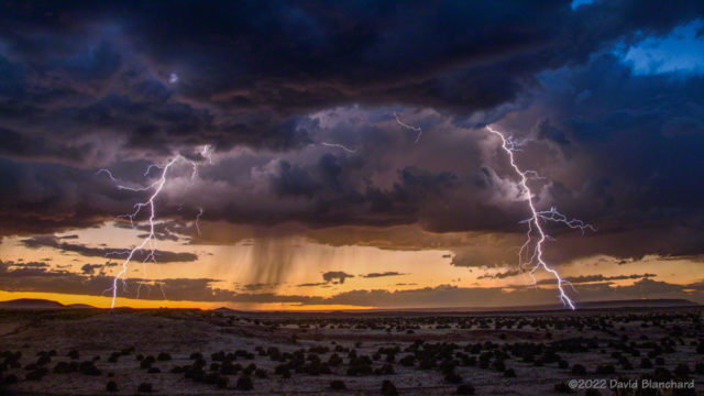 An isolated thunderstorm produced lightning at sunset over the San Francisco Volcanic Field.