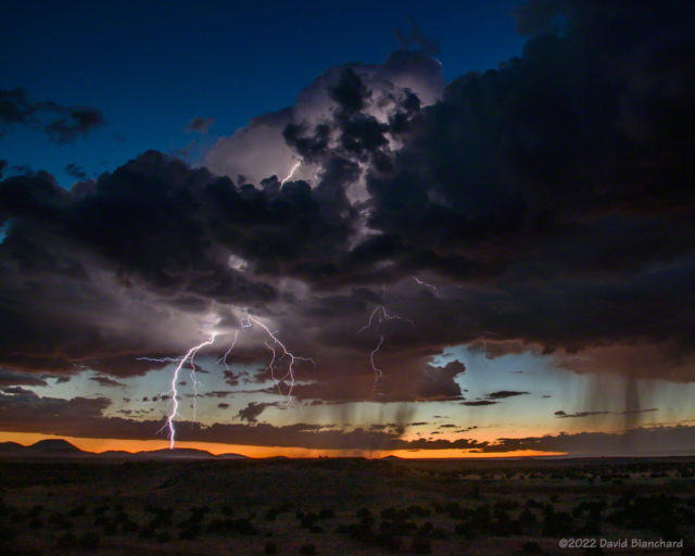 An isolated thunderstorm produced lightning at sunset over the San Francisco Volcanic Field.