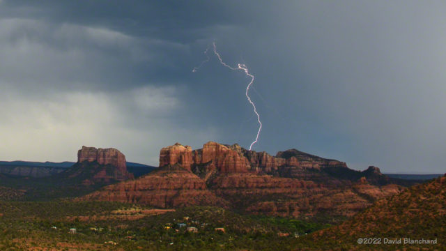 Lightning beyond Cathedral Rock in Sedona, Arizona.