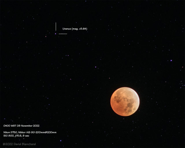 Lunar eclipse at maximum totality. Th planet Uranus is also visible in the upper portion of the image.