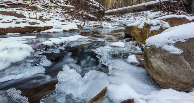 Running water and ice fill the shaded depths of West Fork Oak Creek.
