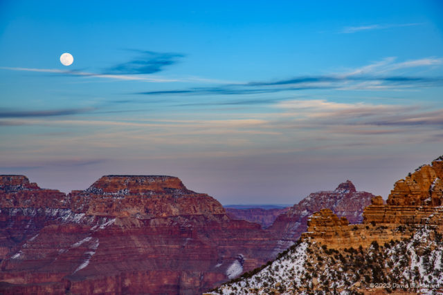 The nearly-full Moon rises above the North Rim of Grand Canyon.