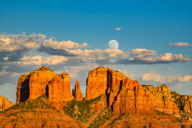 The Moon rises above the clouds at Cathedral Rock in Sedona, Arizona (1909 MST)