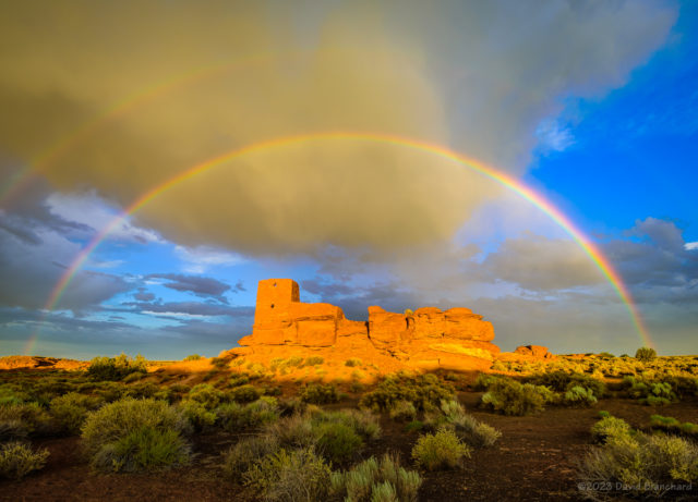 A double rainbow arches above Wukoki Pueblo in Wupatki National Monument.