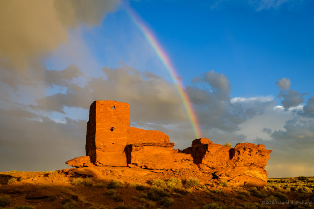 A segment of a rainbow over Wukoki Pueblo in Wupatki National Monument.