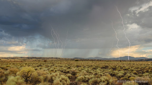 Composite image of late afternoon lightning strikes over the grasslands of Wupatki National Monument.