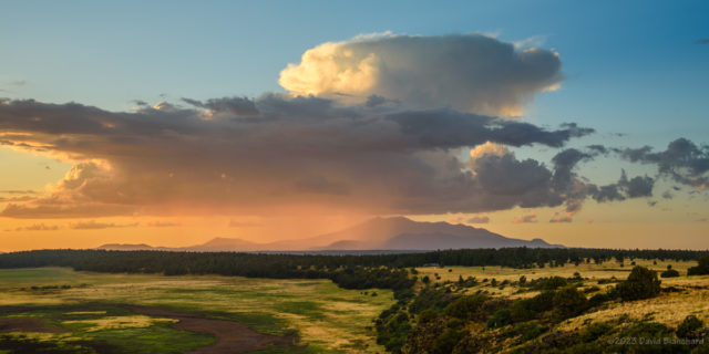 Another storm develops to the north over the San Francisco Peaks.