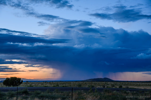 A small thunderstorm during twilight hours.
