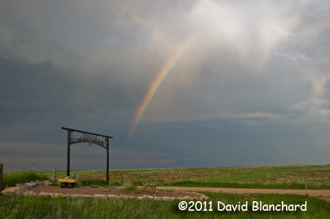 Partial rainbow from a weakening thunderstorm over the Black Hills.